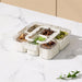 6-compartment meal prep container measuring 21 x 21 x 7 cm
