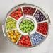 Round Food Storage Container with multi compartments filled with assorted fresh fruits