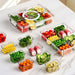 Kitchen storage container with removable condiment containers and organised fresh vegetables