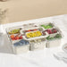 Meal prep container with 9 organised compartments for fresh food and ingredients