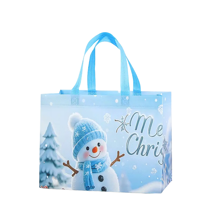 Light blue Christmas tote bag featuring a cheerful snowman in a blue winter hat and scarf, with snowy trees and snowflakes.