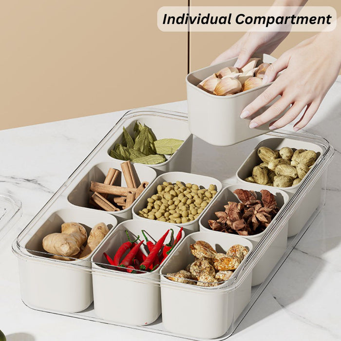 Removable inner compartment tray lifted from multi-grid storage organiser