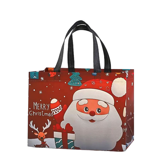 Red Christmas tote bag with black handles featuring a cheerful Santa Claus holding a gift, with a reindeer and festive Christmas tree details