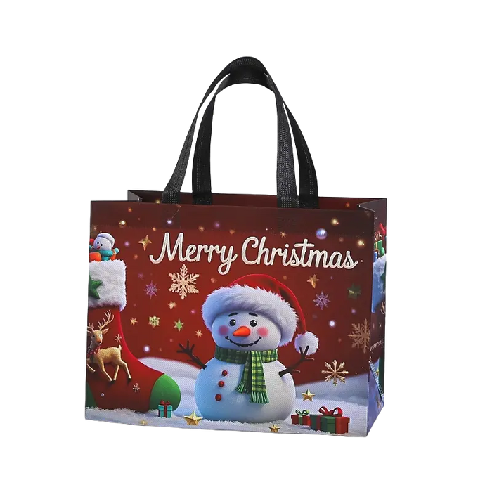 Red Christmas tote bag with black handles featuring a cheerful snowman in a Santa hat and green scarf, with snowflakes, reindeer and gifts.