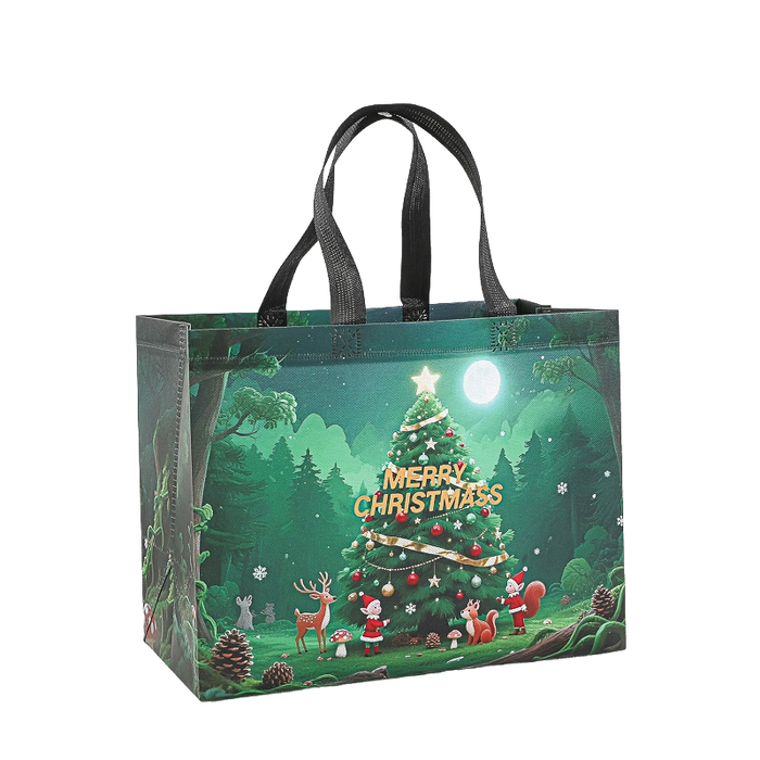 Green Christmas tote bag with decorated Christmas tree, reindeer and woodland Christmas scene
