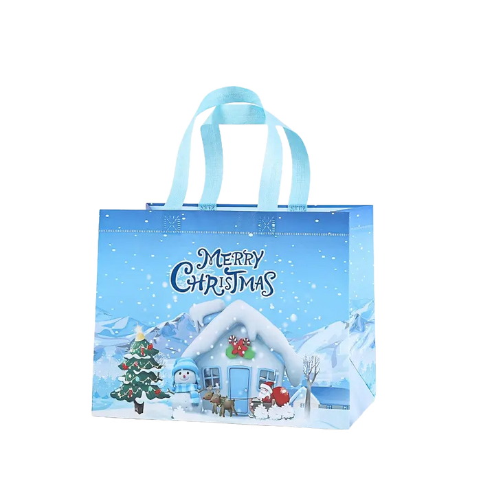 Light blue Christmas tote bag with snowy cottage, Christmas tree, snowman, reindeer and Santa