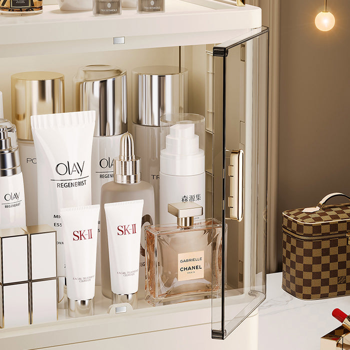 Close-up of transparent doors and gold-plated handles on makeup drawer organiser