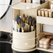 Close-up of makeup brush holder compartment in a makeup organiser